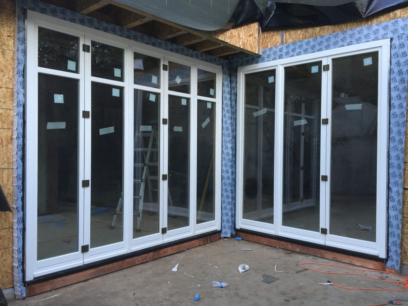 Narrow windows flanking custom front door in Solana Beach, CA
